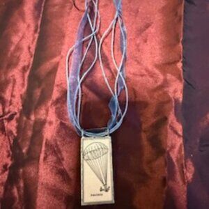 Parachute Tile Pendant on blue ribbon